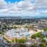 Aerial view of Medway Maritime Hospital in Gillingham, Kent, showing the hospital buildings and surrounding urban area, with the River Medway in the background.