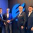 Victaulic and Electra M&E Polska representatives mark their expanded collaboration, with Ronen Bretter and Sebastian Matijasevich shaking hands alongside colleagues.